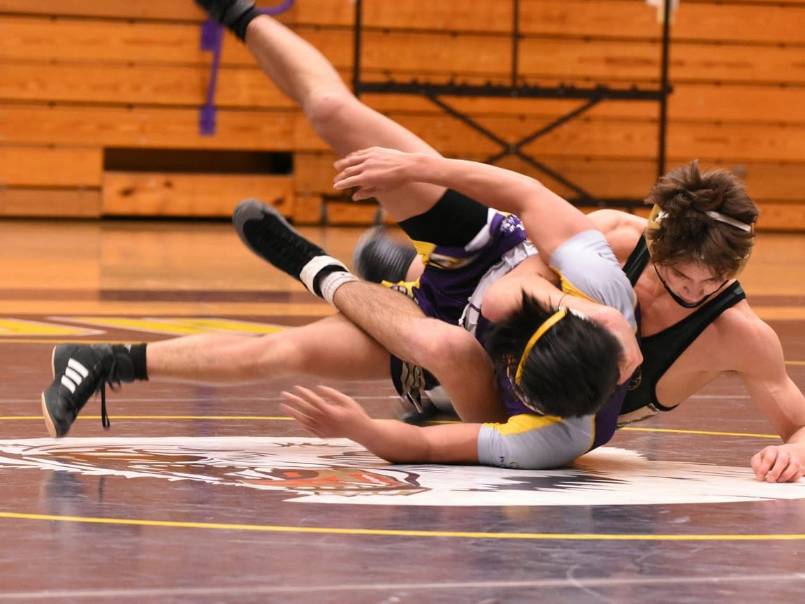 An empty wrestling mat before a meet.